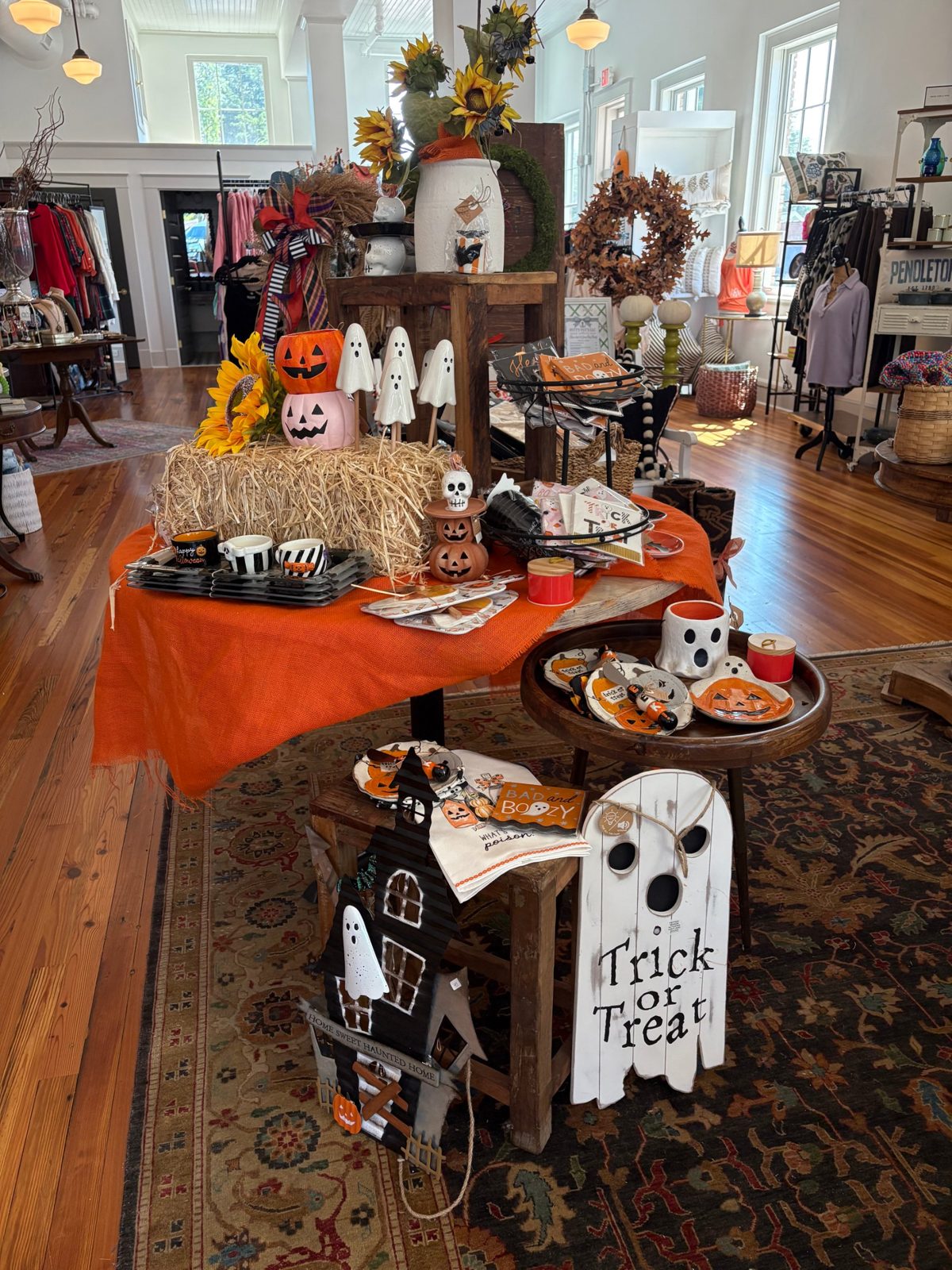 A Halloween display of pumpkins, ghosts and tea towels